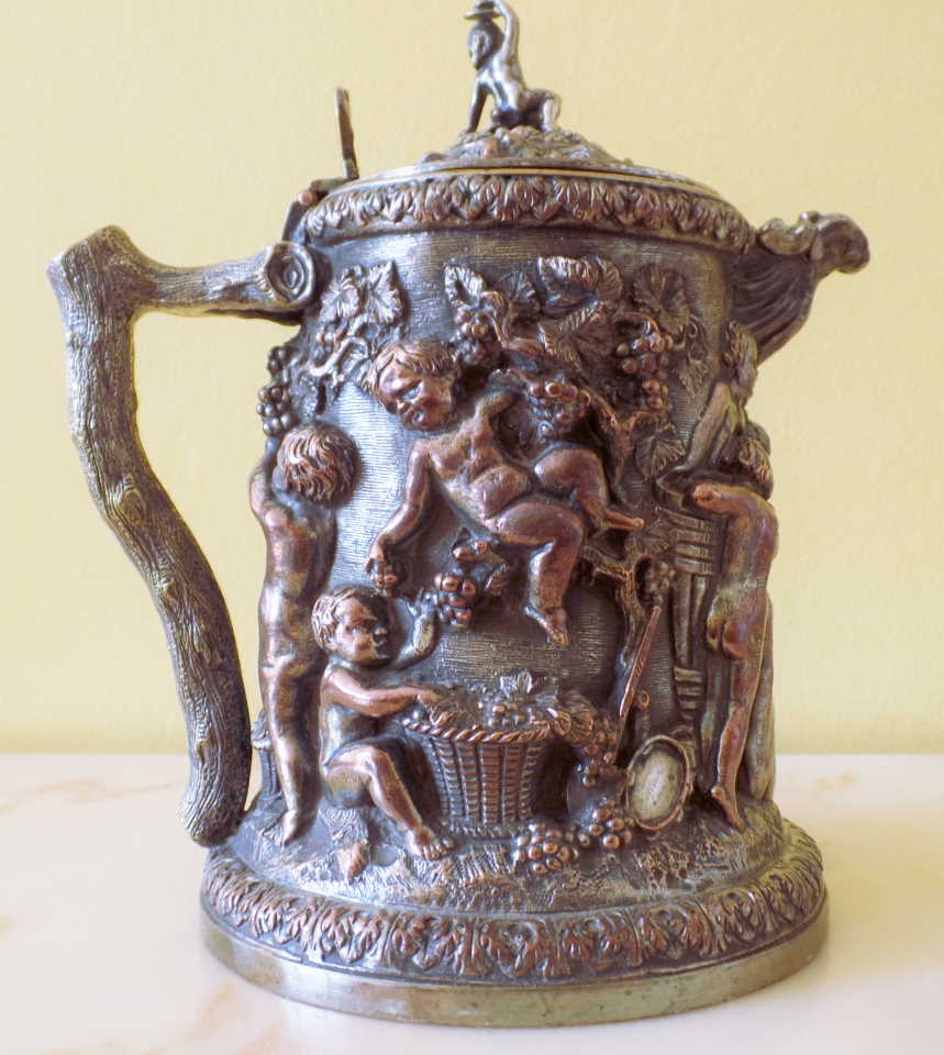 Antique electro jug with putti picking grapes